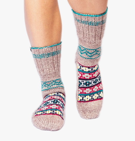 The Hamesha socks are brown with emerald green, black, and maroon details. They contain the traditional Himalayan patterns of barra gow (big pendant) and bulabul station (nightingale station), which are patterns that have existed in this community for centuries