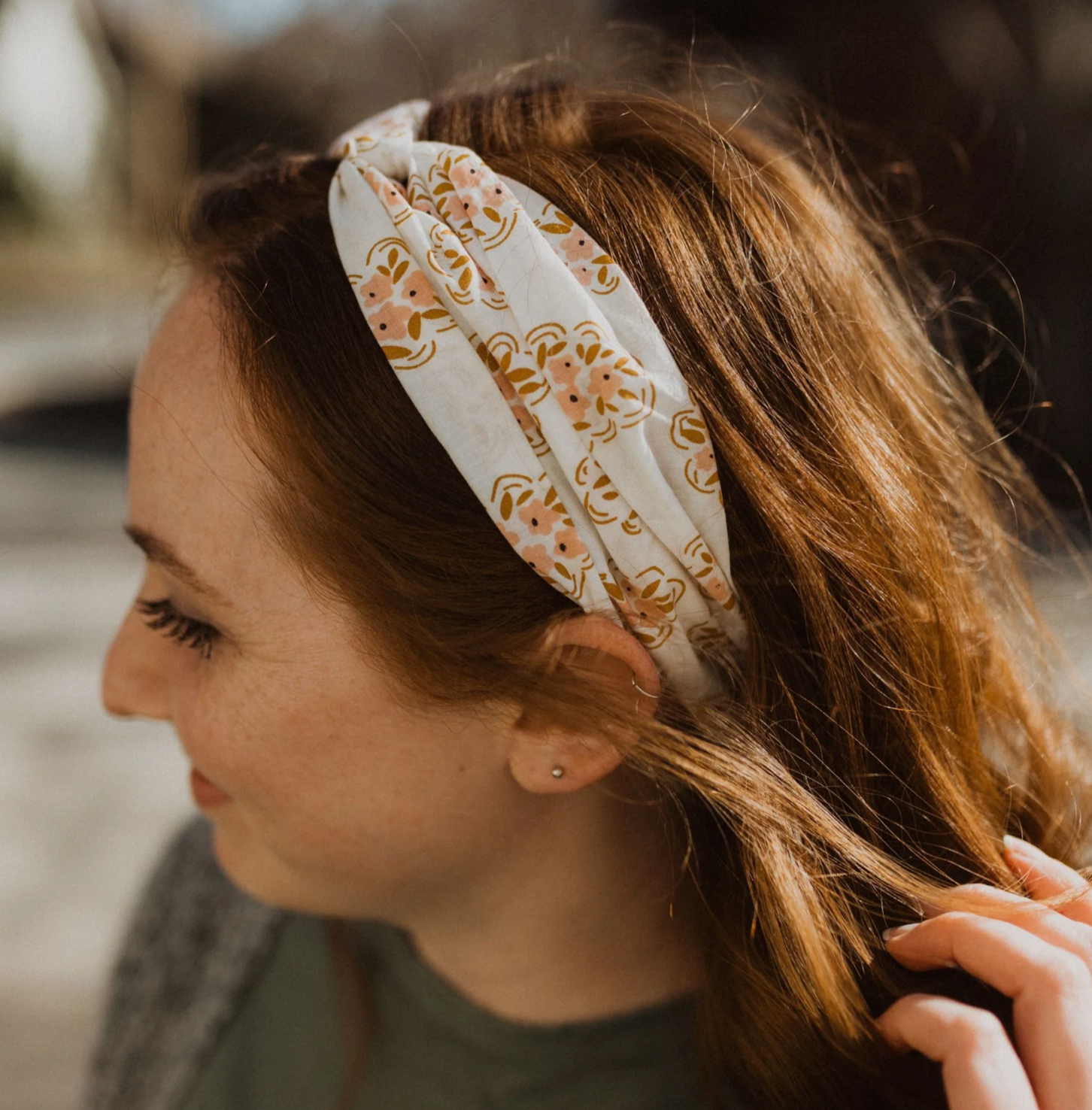 a close up shot of a girl wearing the cotton twist headband 